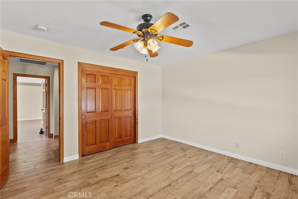 902 Searchlight Ranch Road Acton, CA 93510 - Photo 22 of 52 a view of empty room with wooden floor