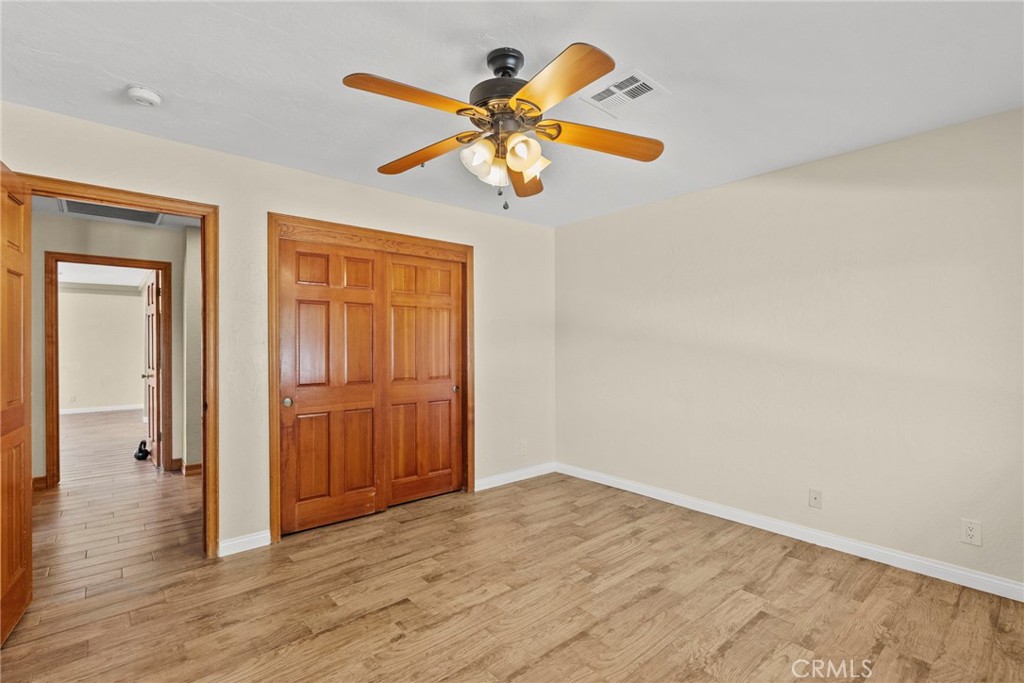 902 Searchlight Ranch Road Acton, CA 93510 - Photo 22 of 52 a view of empty room with wooden floor
