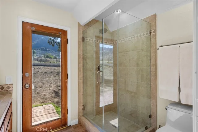 a bathroom with a granite countertop sink mirror and vanity