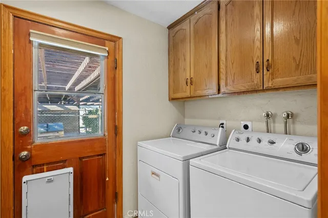 a bathroom with a toilet sink vanity and mirror