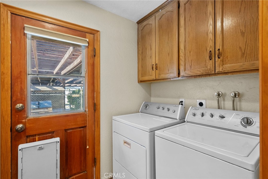 902 Searchlight Ranch Road Acton, CA 93510 - Photo 32 of 52 a utility room with dryer and washer