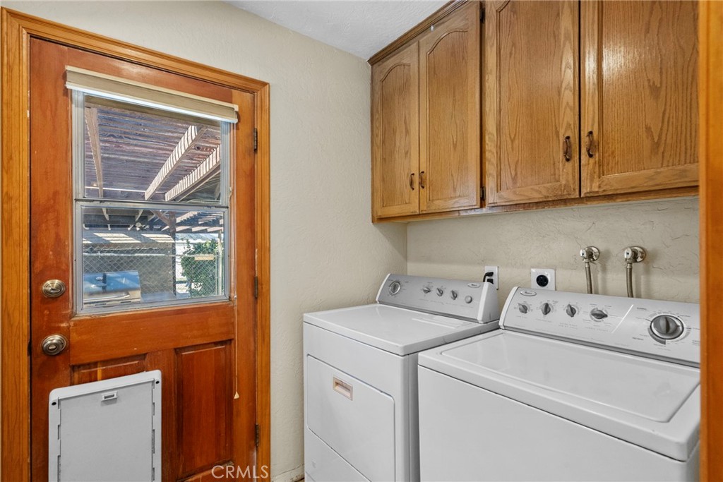 902 Searchlight Ranch Road Acton, CA 93510 - Photo 32 of 52 a utility room with dryer and washer