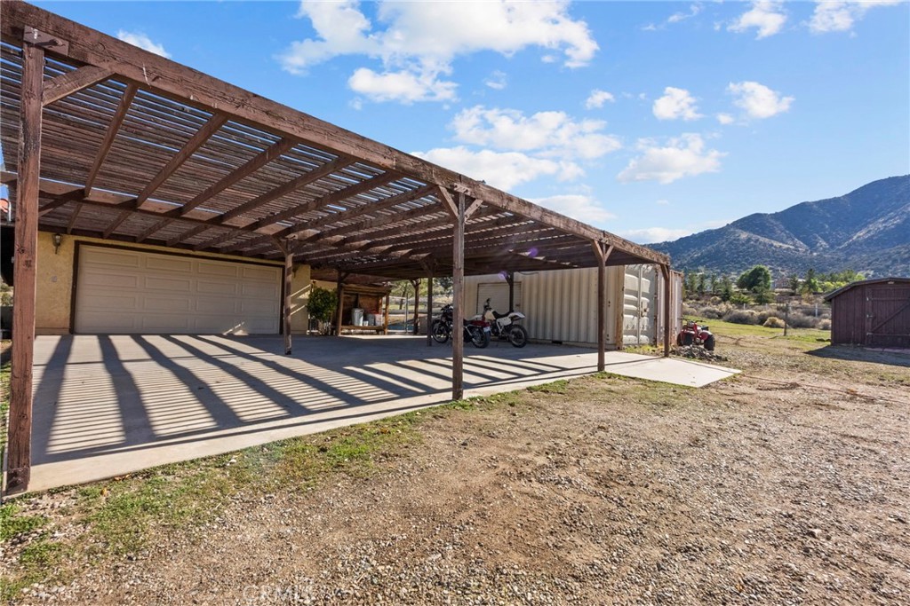 902 Searchlight Ranch Road Acton, CA 93510 - Photo 34 of 52 a view of a backyard with a patio