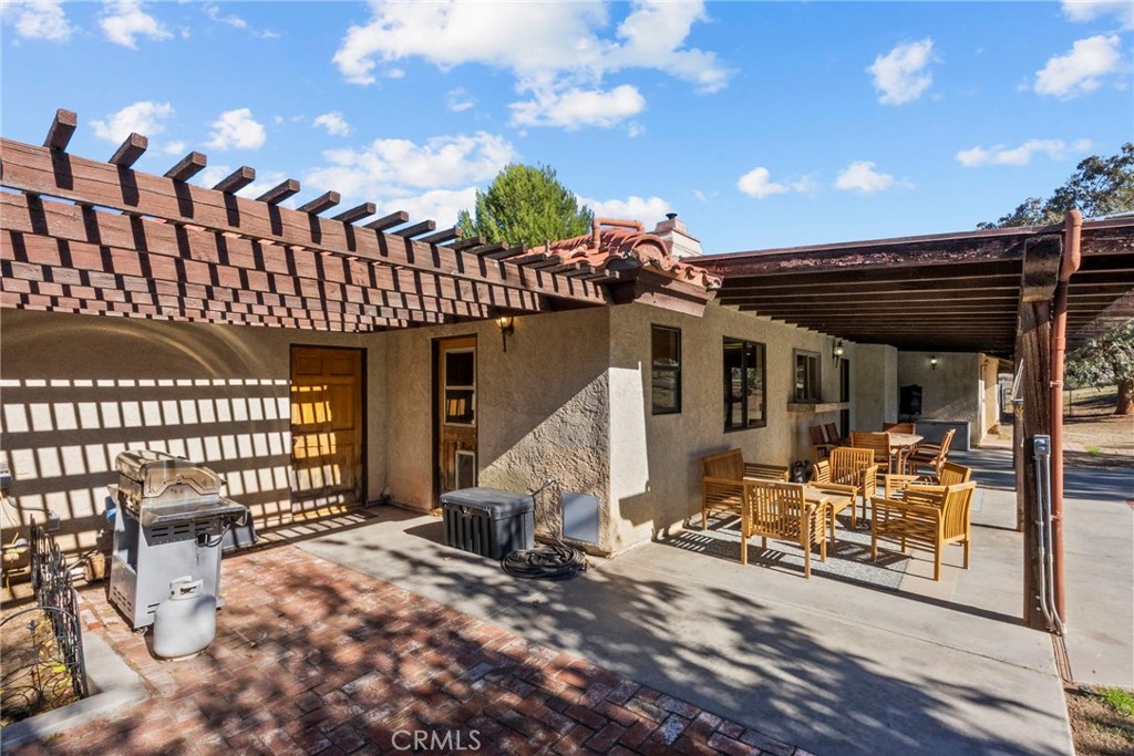 902 Searchlight Ranch Road Acton, CA 93510 - Photo 35 of 52 a view of a house with a patio