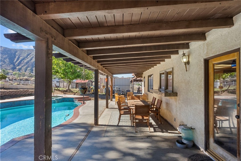 902 Searchlight Ranch Road Acton, CA 93510 - Photo 38 of 52 a view of a porch with chairs and couches with wooden floor