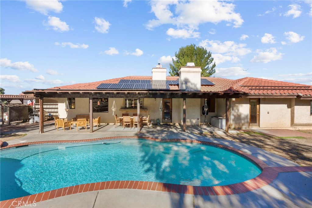 902 Searchlight Ranch Road Acton, CA 93510 - Photo 40 of 52 a view of a house with swimming pool and sitting area