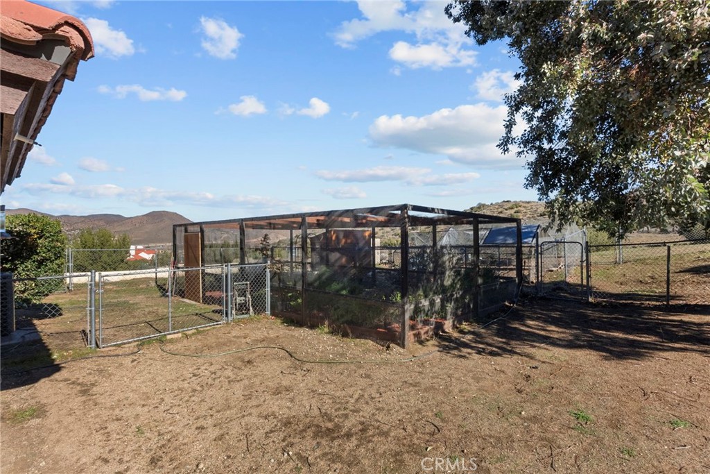 902 Searchlight Ranch Road Acton, CA 93510 - Photo 42 of 52 a view of a house with backyard and sitting area