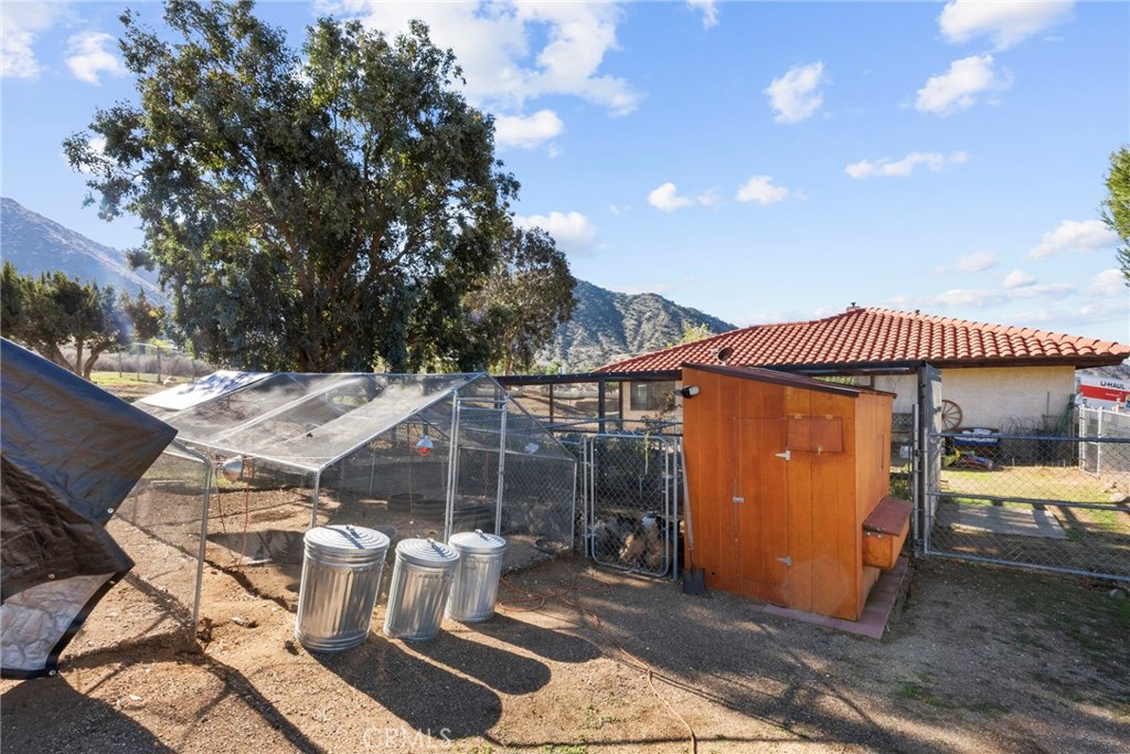 902 Searchlight Ranch Road Acton, CA 93510 - Photo 43 of 52 a view of a patio with table and chairs and potted plants