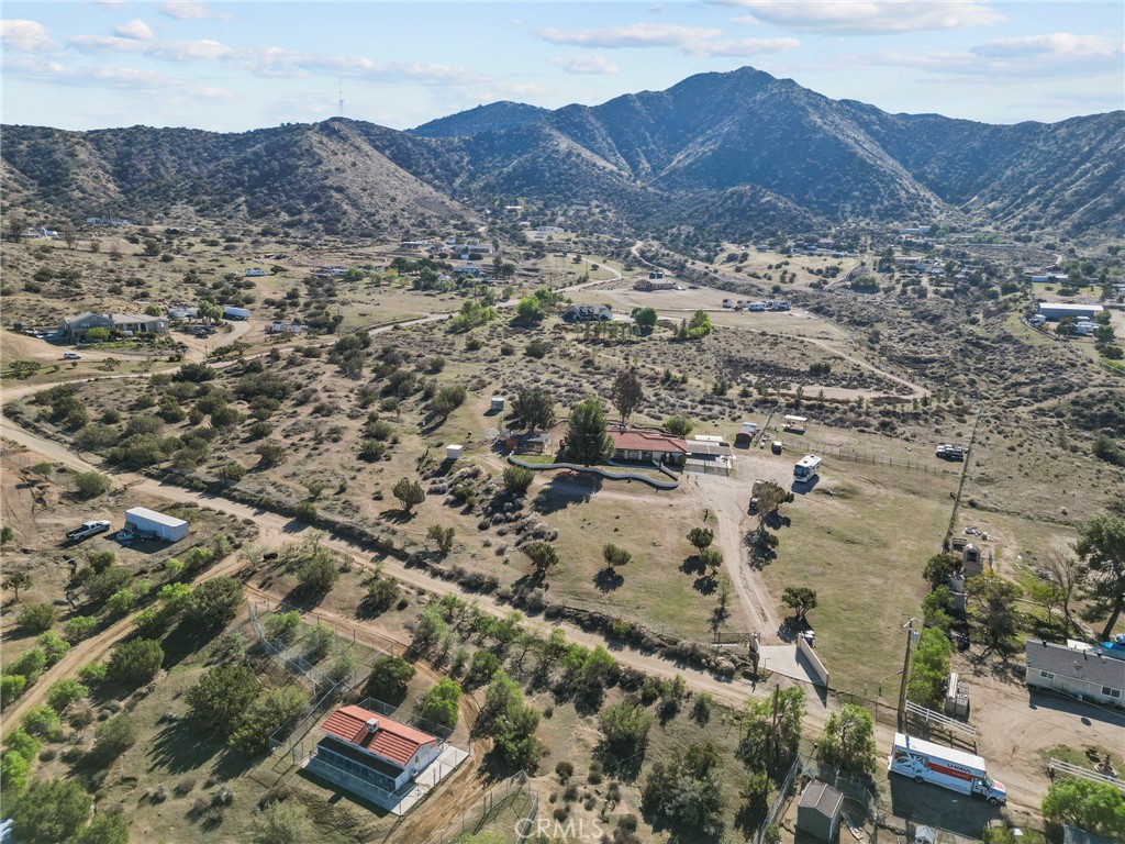 902 Searchlight Ranch Road Acton, CA 93510 - Photo 50 of 52 an aerial view of residential house and sandy dunes