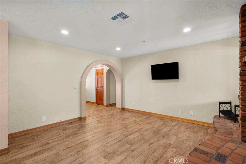 902 Searchlight Ranch Road Acton, CA 93510 - Photo 7 of 52 a view of a livingroom with an empty space and a window