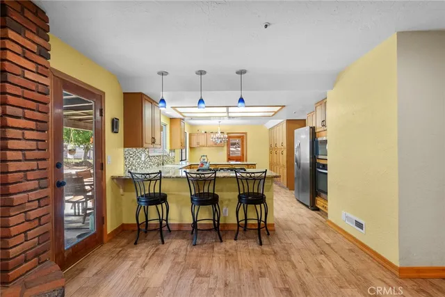 a dining room with furniture and wooden floor