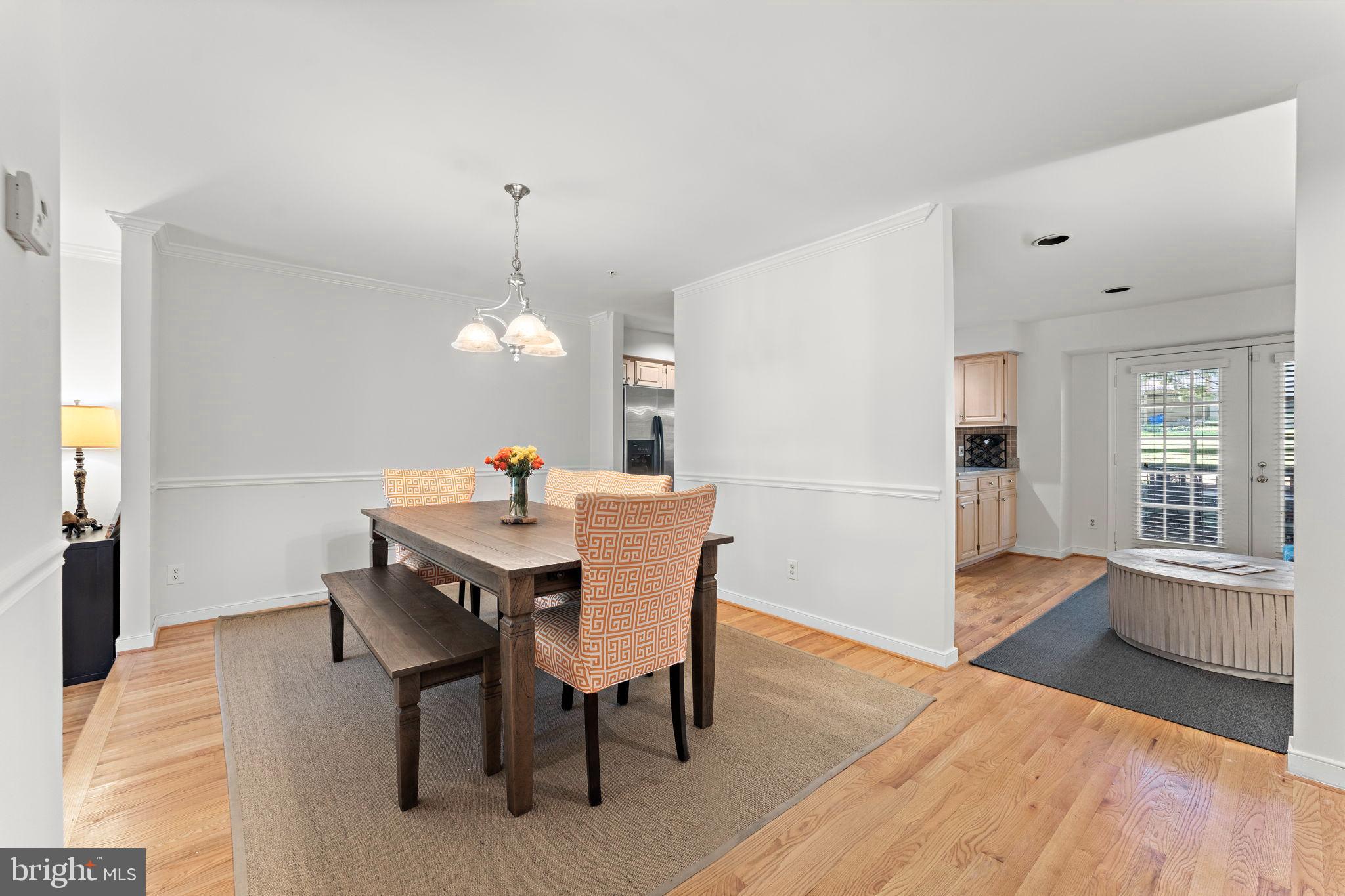 10934 Rocky Mt Way Silver Spring, MD 20902 - Photo 11 of 51 a dining room with furniture window and wooden floor