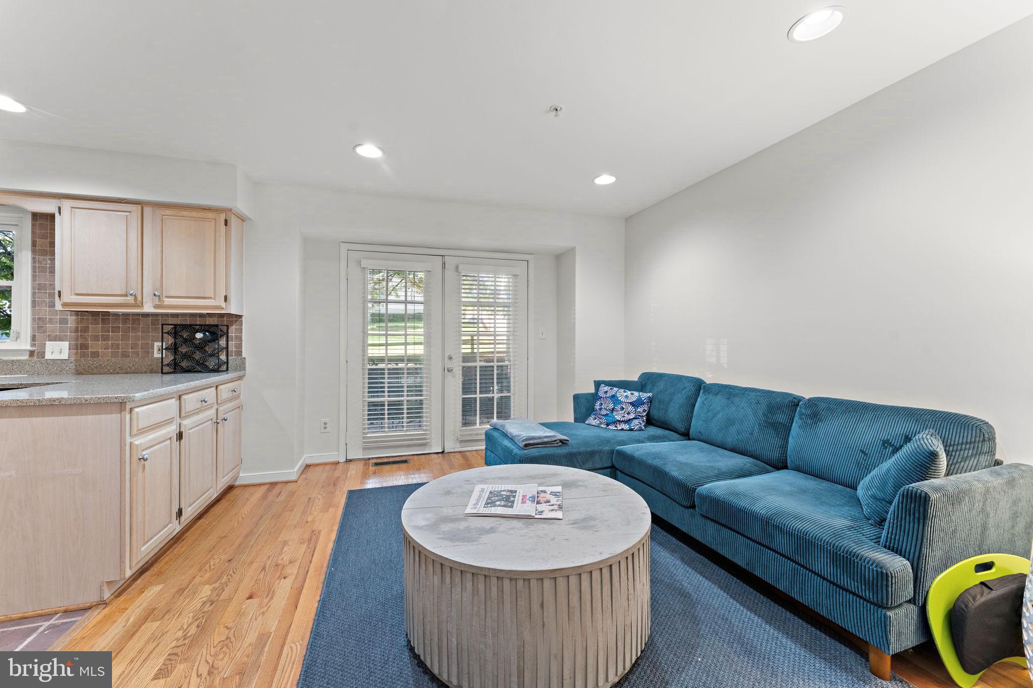 10934 Rocky Mt Way Silver Spring, MD 20902 - Photo 12 of 51 a living room with furniture and a wooden floor