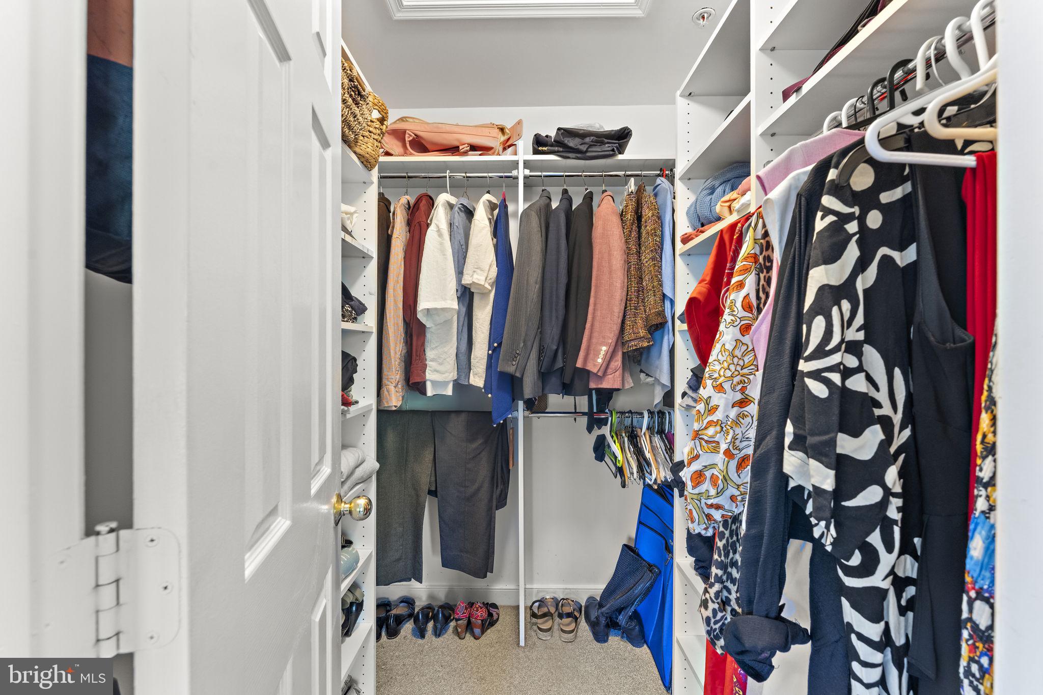 10934 Rocky Mt Way Silver Spring, MD 20902 - Photo 26 of 51 a view of walk in closet with clothes