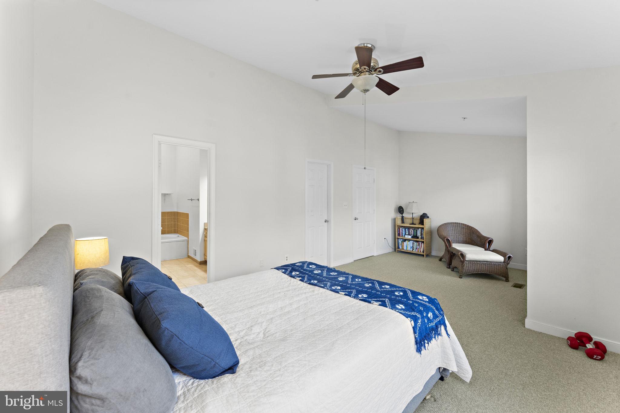 10934 Rocky Mt Way Silver Spring, MD 20902 - Photo 27 of 51 a bedroom with a bed and a ceiling fan