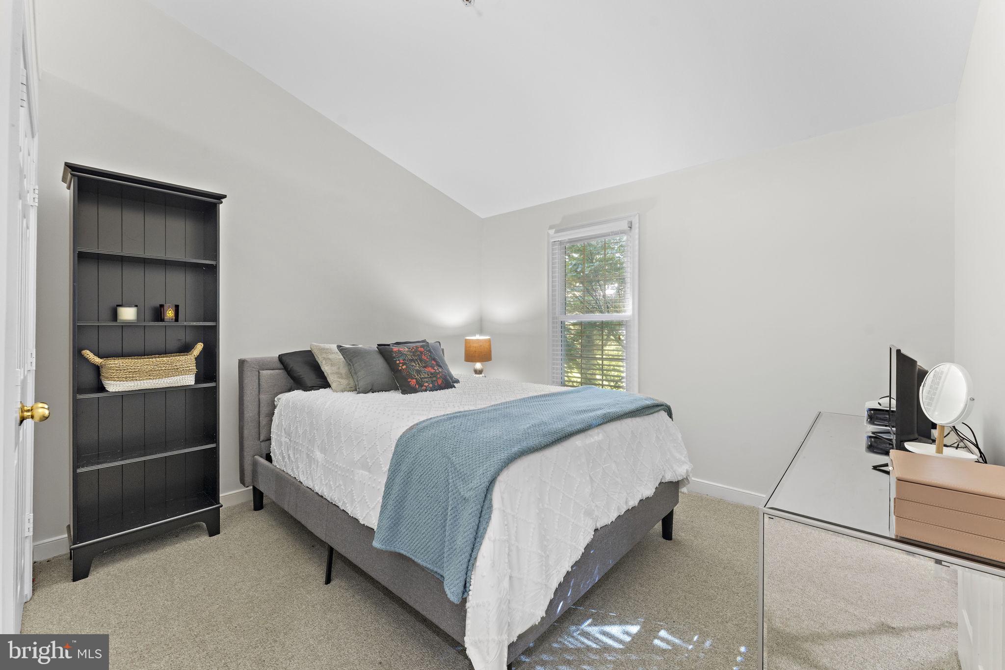 10934 Rocky Mt Way Silver Spring, MD 20902 - Photo 30 of 51 a bedroom with a bed and a mirror