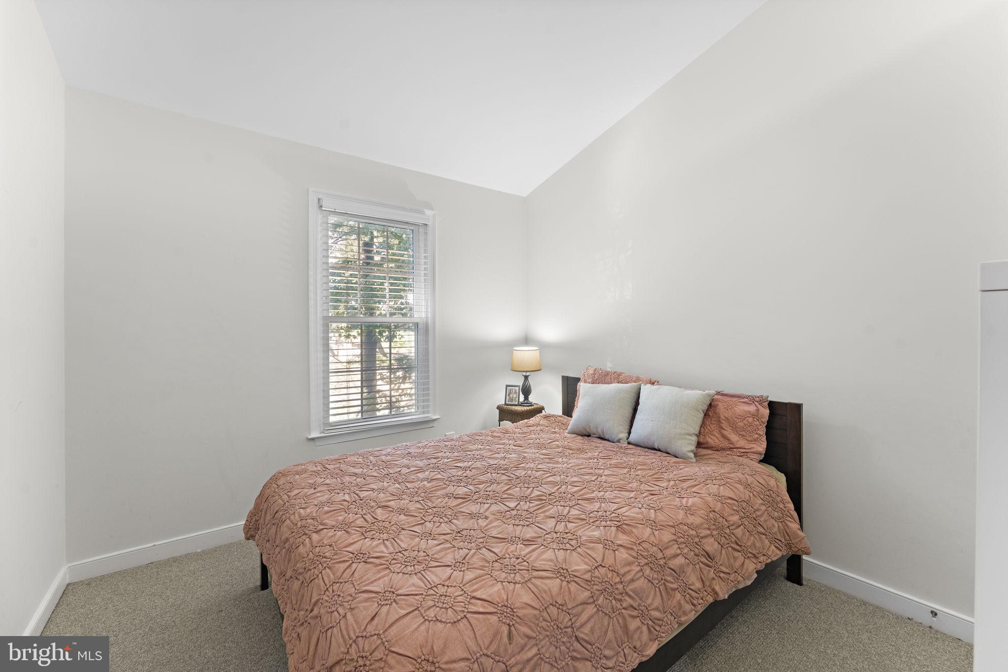 10934 Rocky Mt Way Silver Spring, MD 20902 - Photo 33 of 51 a bedroom with a bed and window