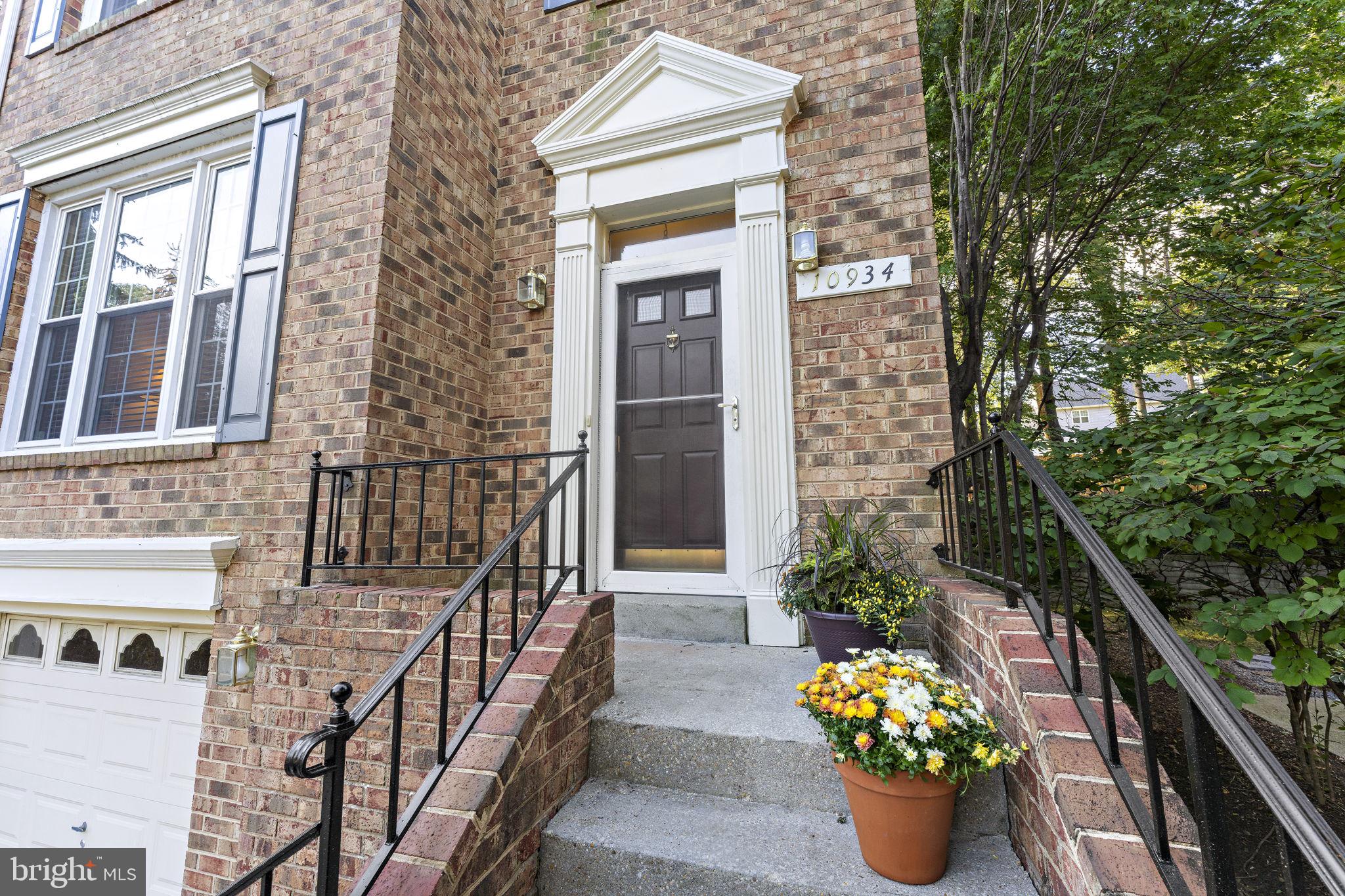 10934 Rocky Mt Way Silver Spring, MD 20902 - Photo 4 of 51 a view of a balcony with chairs and potted plants