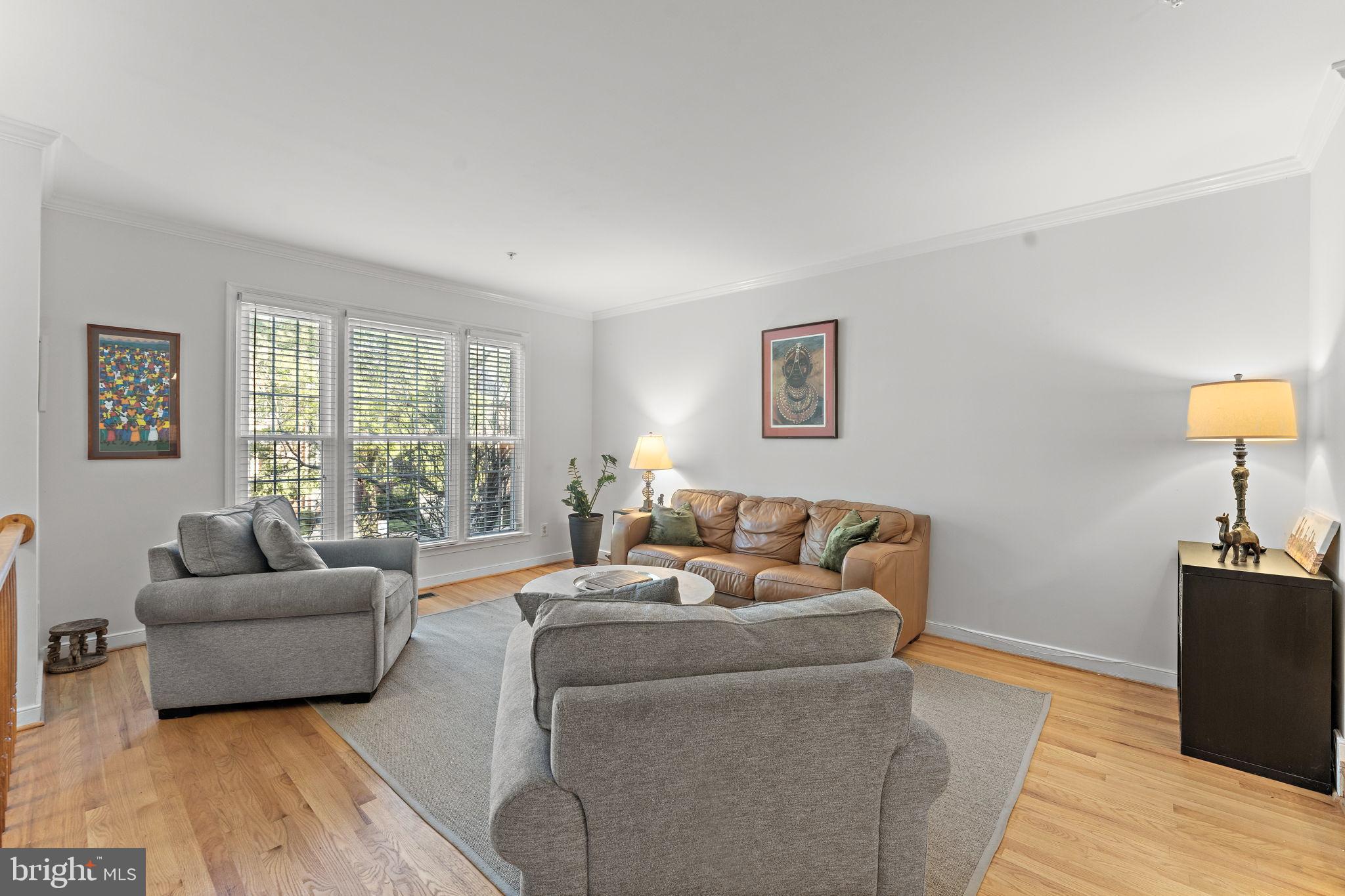 10934 Rocky Mt Way Silver Spring, MD 20902 - Photo 8 of 51 a living room with furniture and a large window