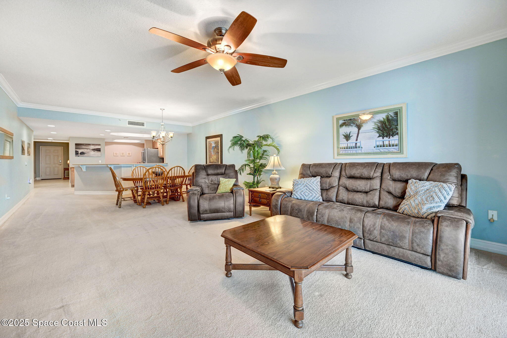 500 Sail Lane, Unit 203 Merritt Island, FL 32953 - Photo 11 of 52 a living room with furniture and a chandelier