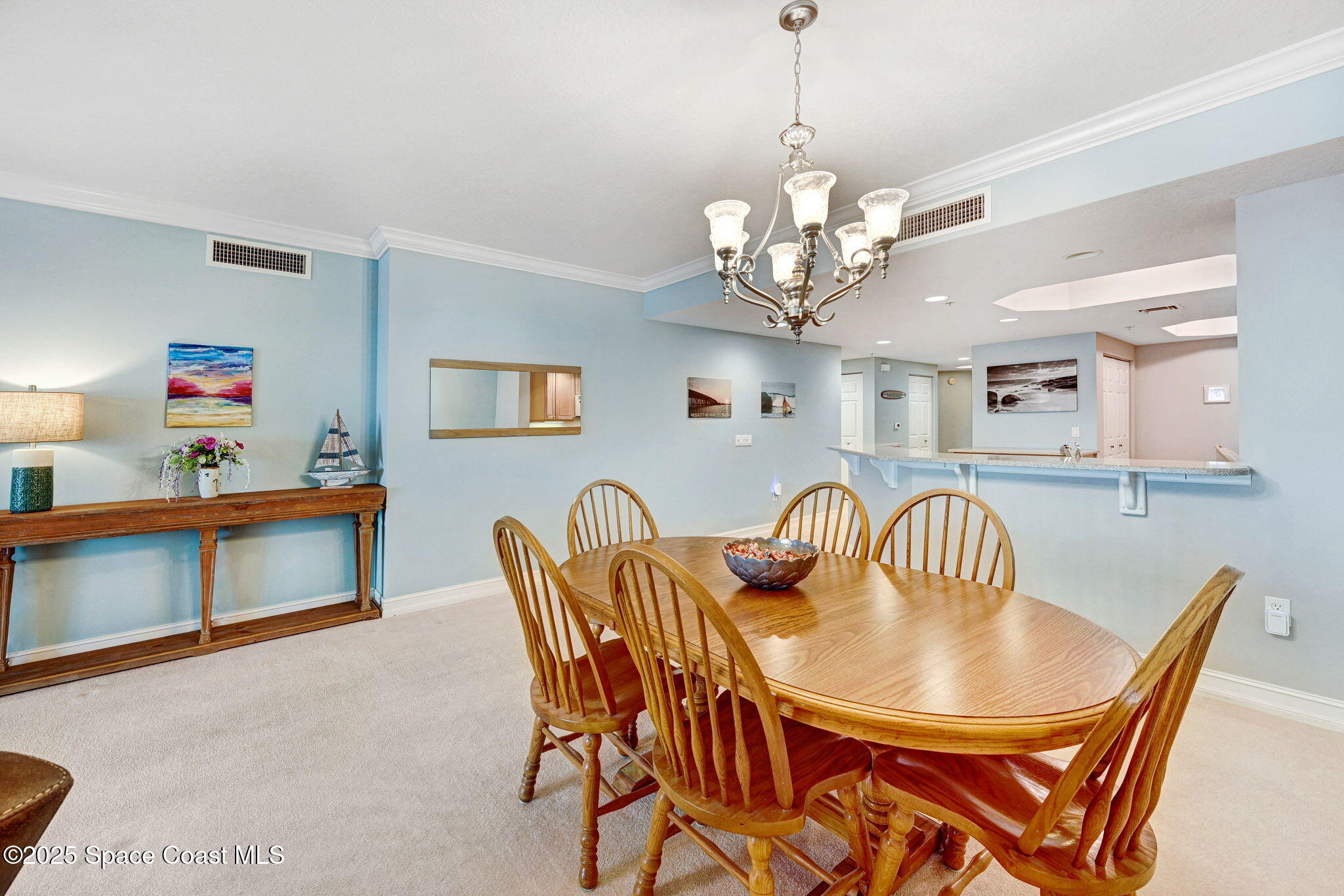 500 Sail Lane, Unit 203 Merritt Island, FL 32953 - Photo 13 of 52 a view of a dining room with furniture