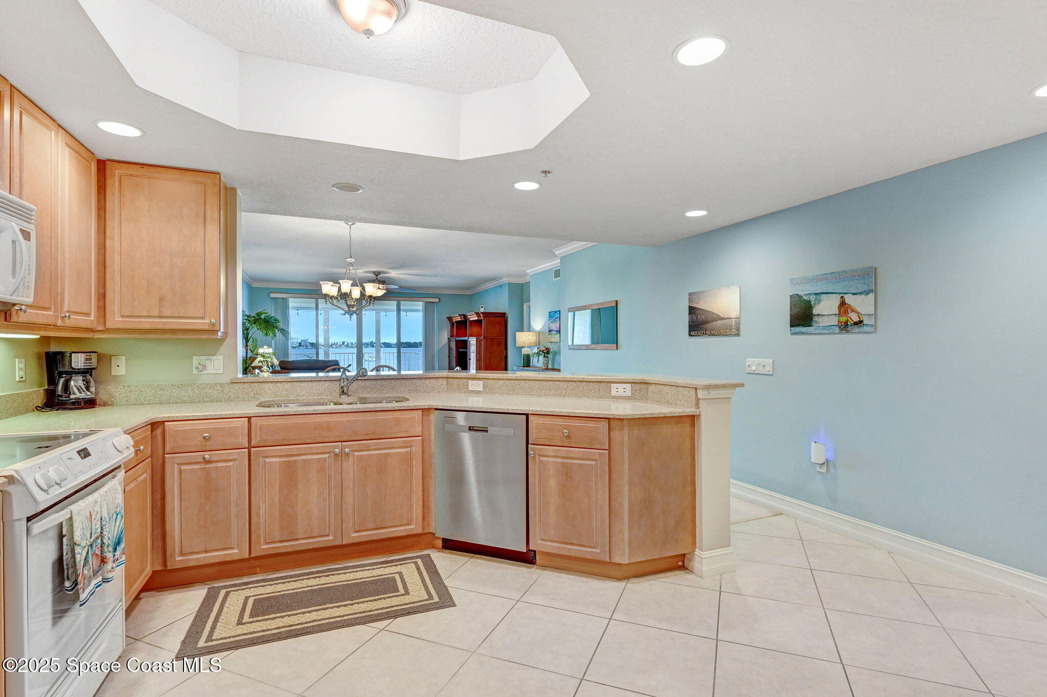 500 Sail Lane, Unit 203 Merritt Island, FL 32953 - Photo 17 of 52 a kitchen with granite countertop cabinets and sink