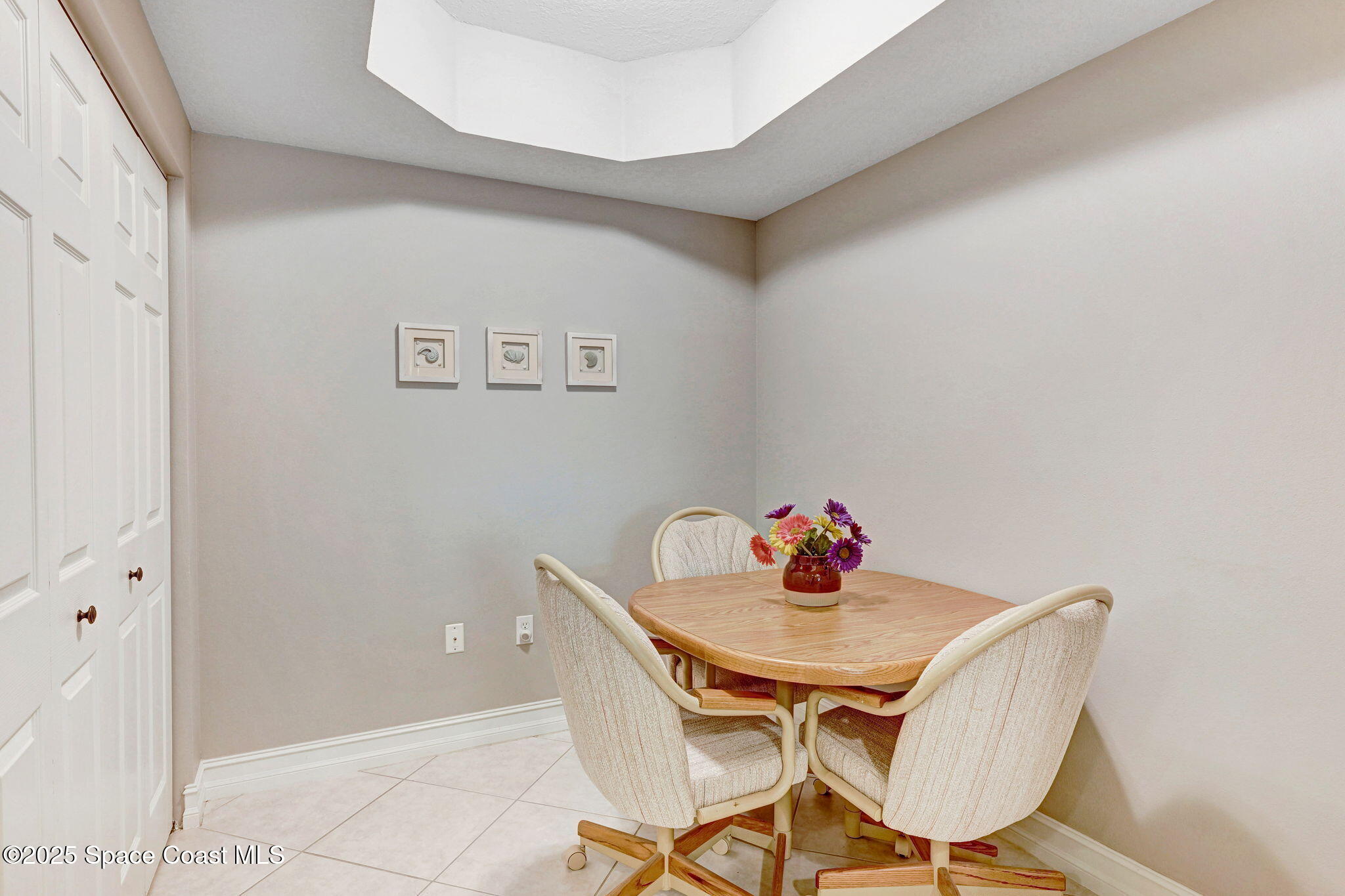 500 Sail Lane, Unit 203 Merritt Island, FL 32953 - Photo 18 of 52 a dining room with furniture and wooden floor