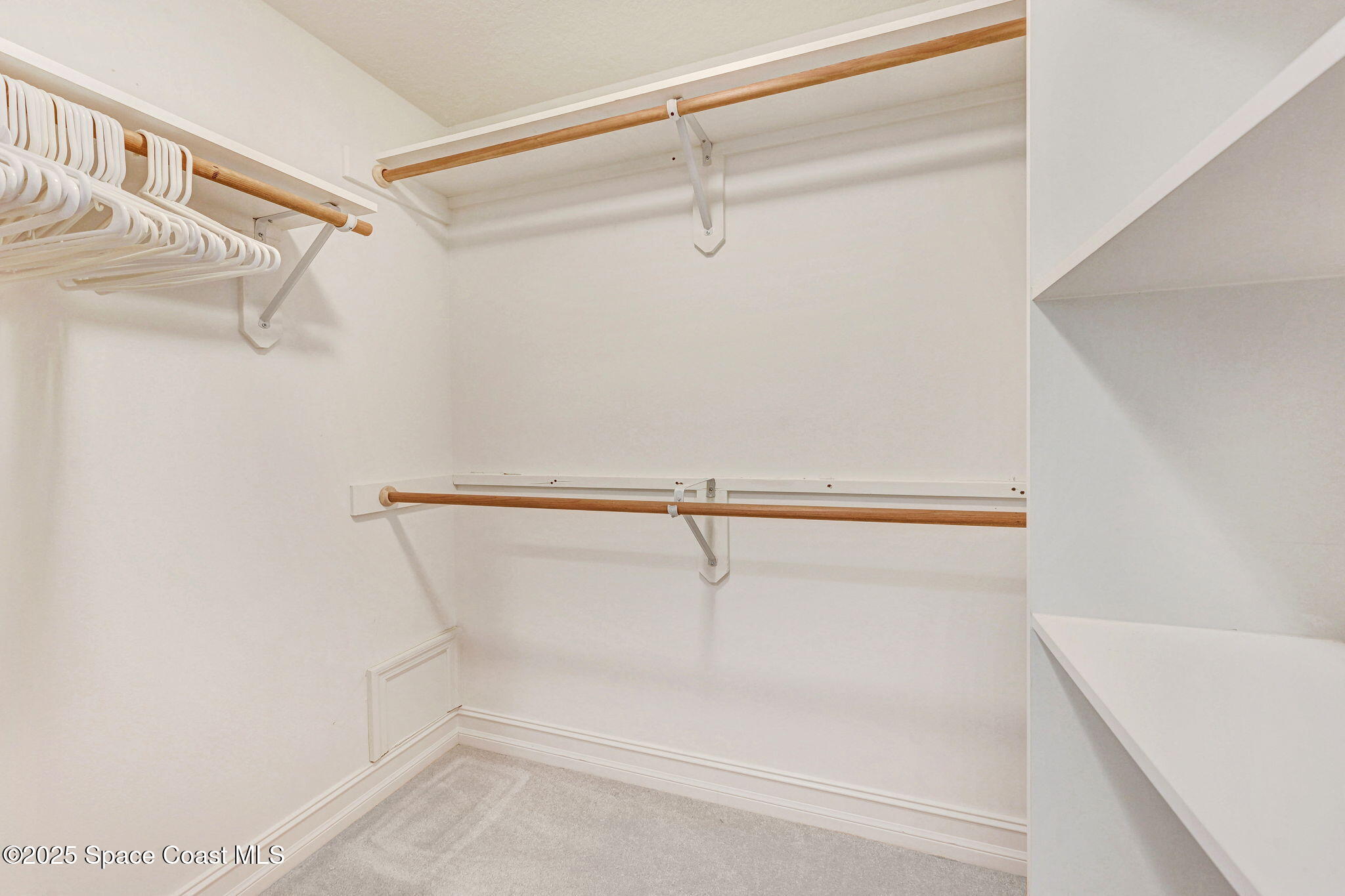 500 Sail Lane, Unit 203 Merritt Island, FL 32953 - Photo 22 of 52 a view of a room with racks on the wall