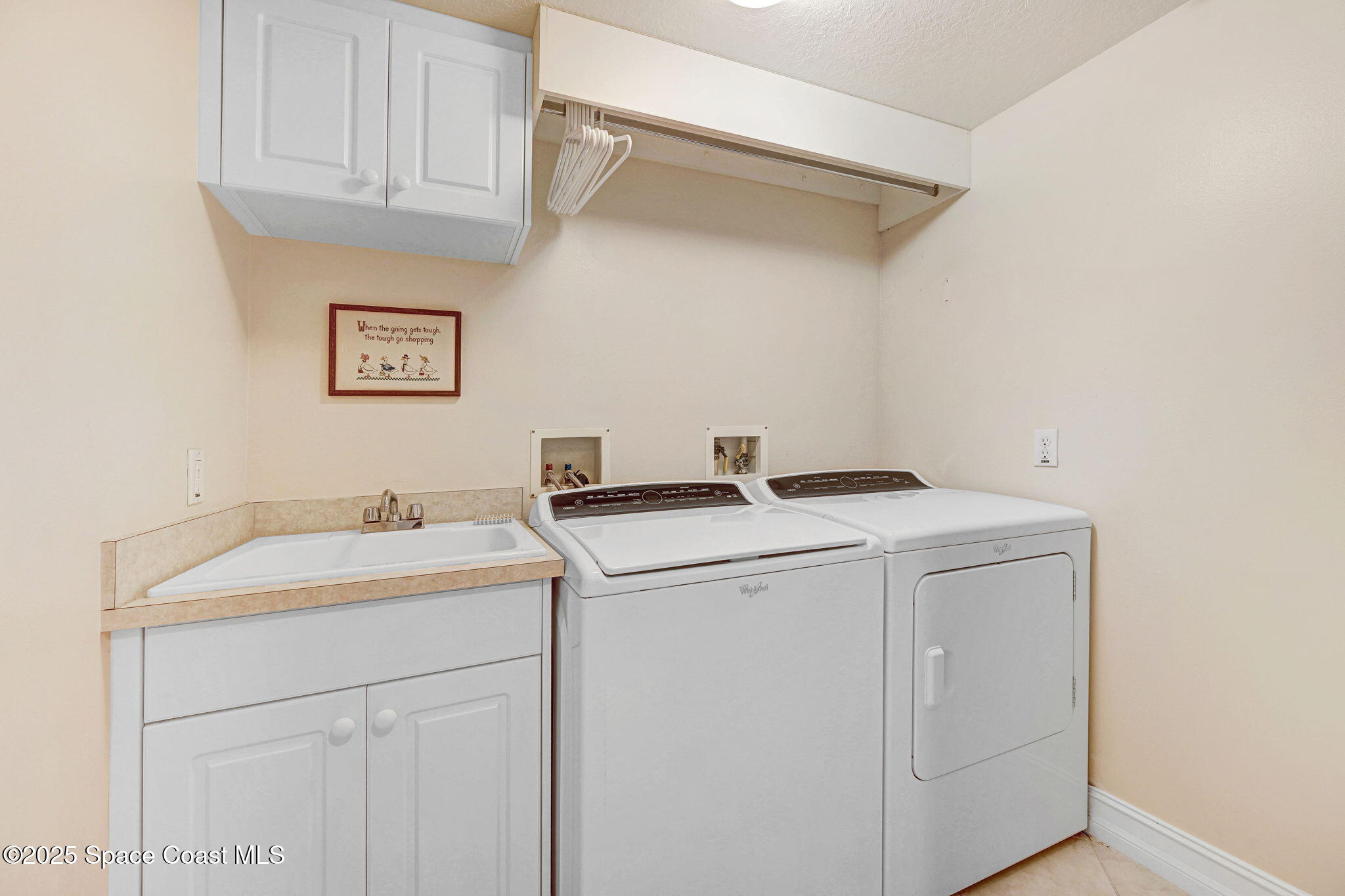 500 Sail Lane, Unit 203 Merritt Island, FL 32953 - Photo 26 of 52 a utility room with dryer and washer