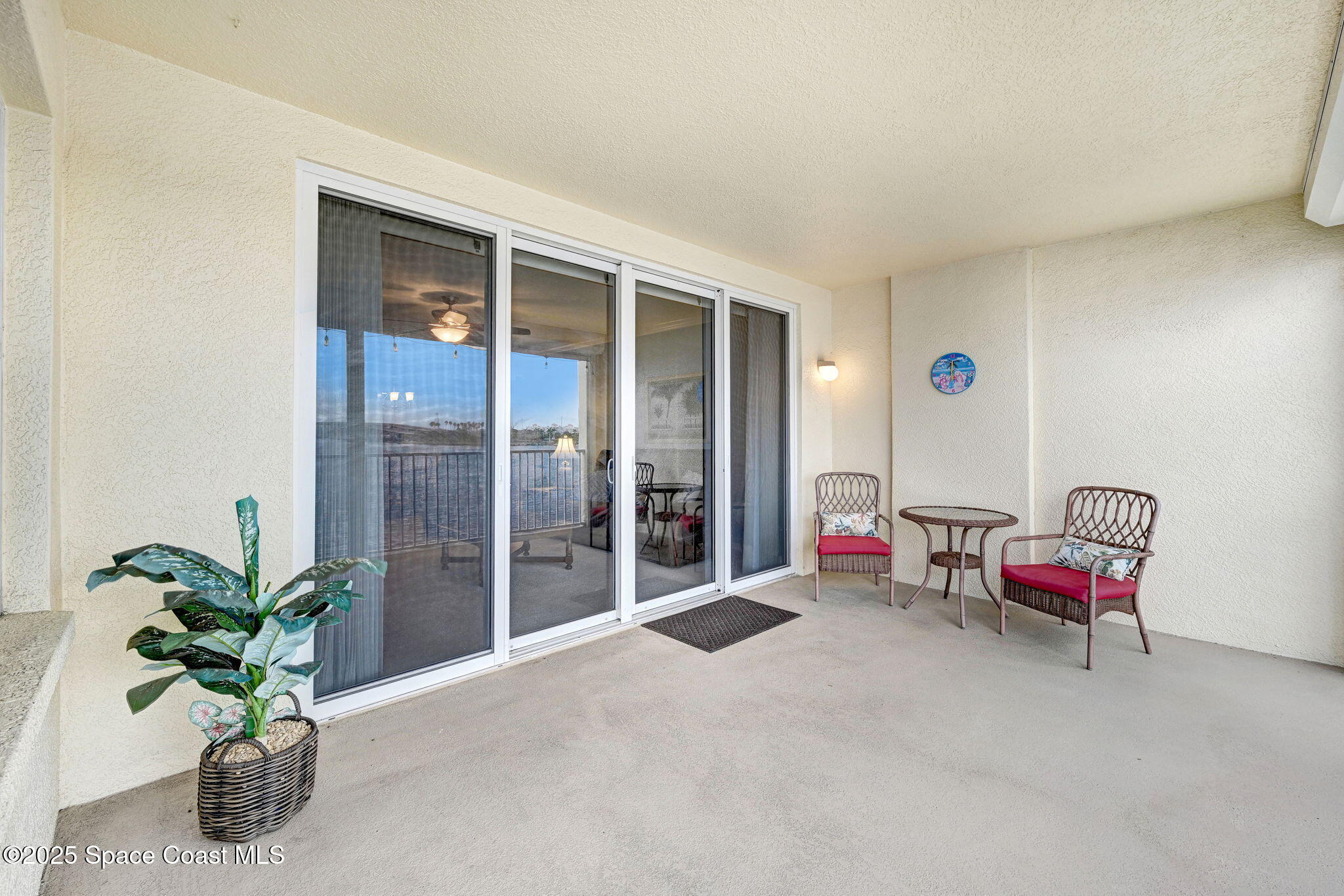 500 Sail Lane, Unit 203 Merritt Island, FL 32953 - Photo 28 of 52 a living room with furniture and a potted plant