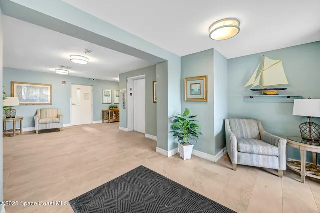 a kitchen with a refrigerator sink and white cabinets
