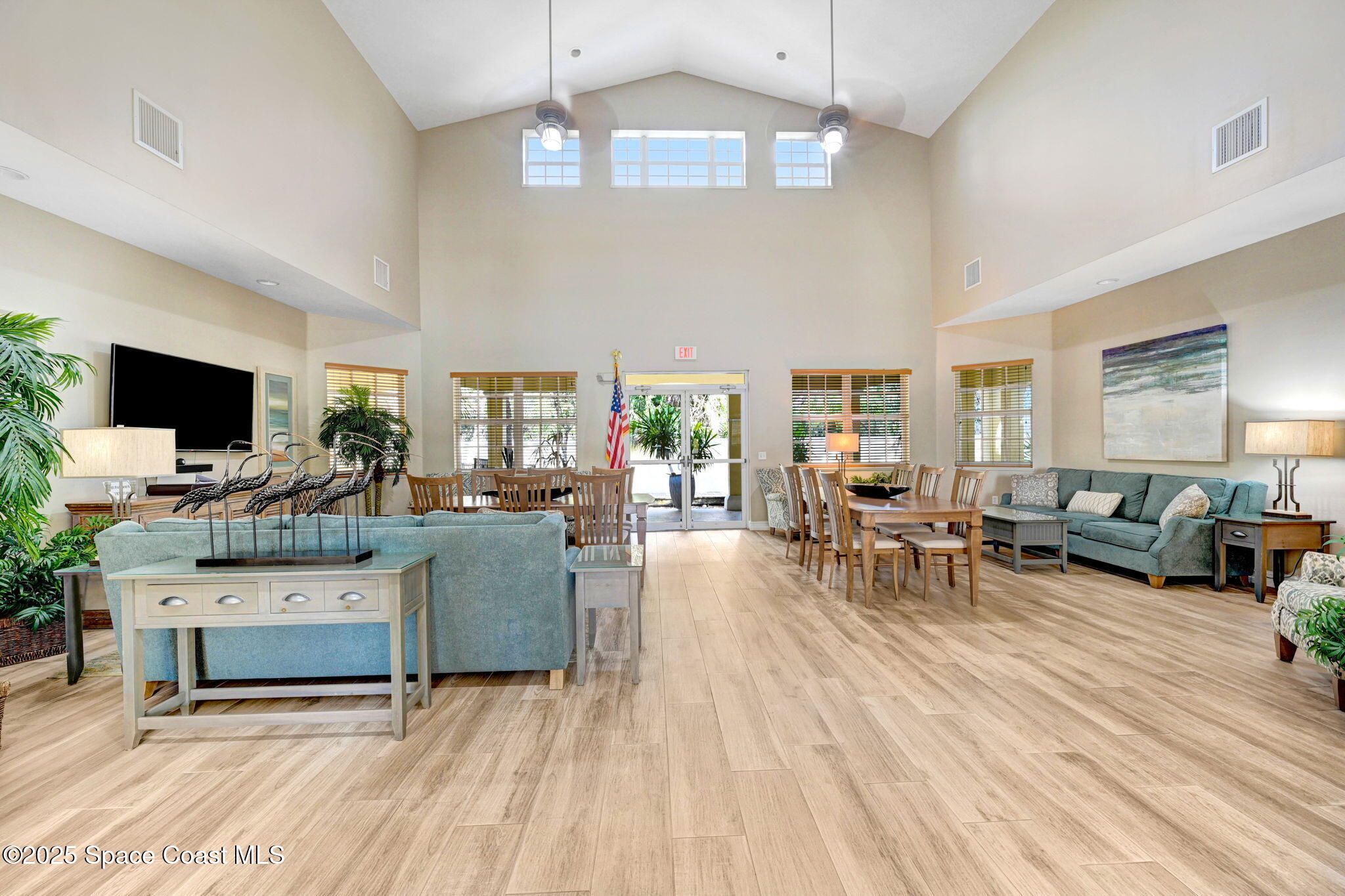 500 Sail Lane, Unit 203 Merritt Island, FL 32953 - Photo 35 of 52 a living room with furniture and a flat screen tv
