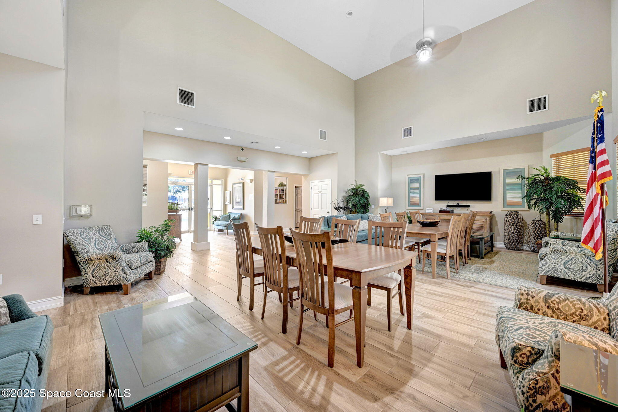 500 Sail Lane, Unit 203 Merritt Island, FL 32953 - Photo 36 of 52 a view of a dining room with furniture and wooden floor