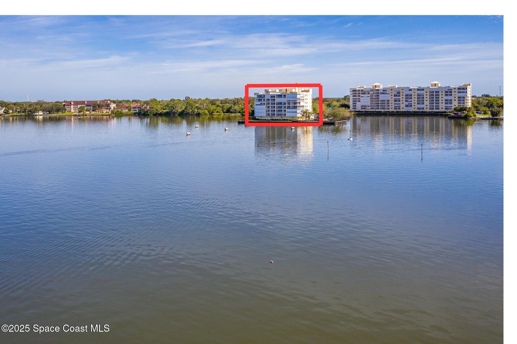500 Sail Lane, Unit 203 Merritt Island, FL 32953 - Photo 6 of 52 a view of a lake with houses