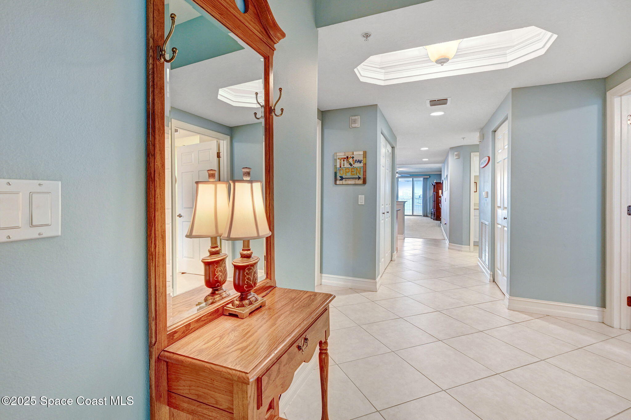 500 Sail Lane, Unit 203 Merritt Island, FL 32953 - Photo 8 of 52 a view of a hallway and a livingroom with furniture