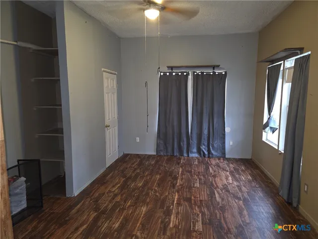 a view of an empty room and window