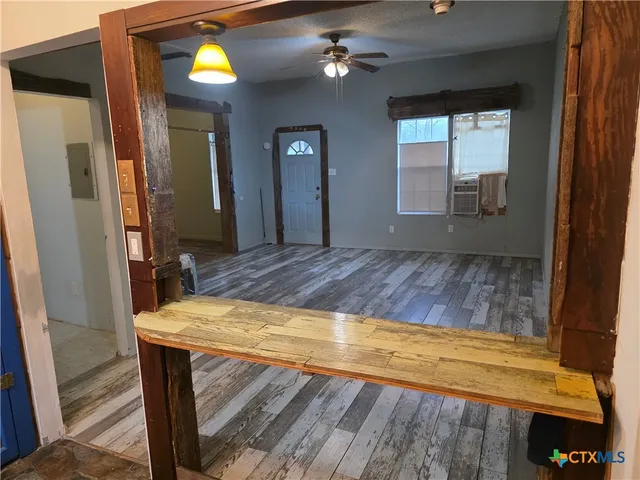 a kitchen with a refrigerator and a stove