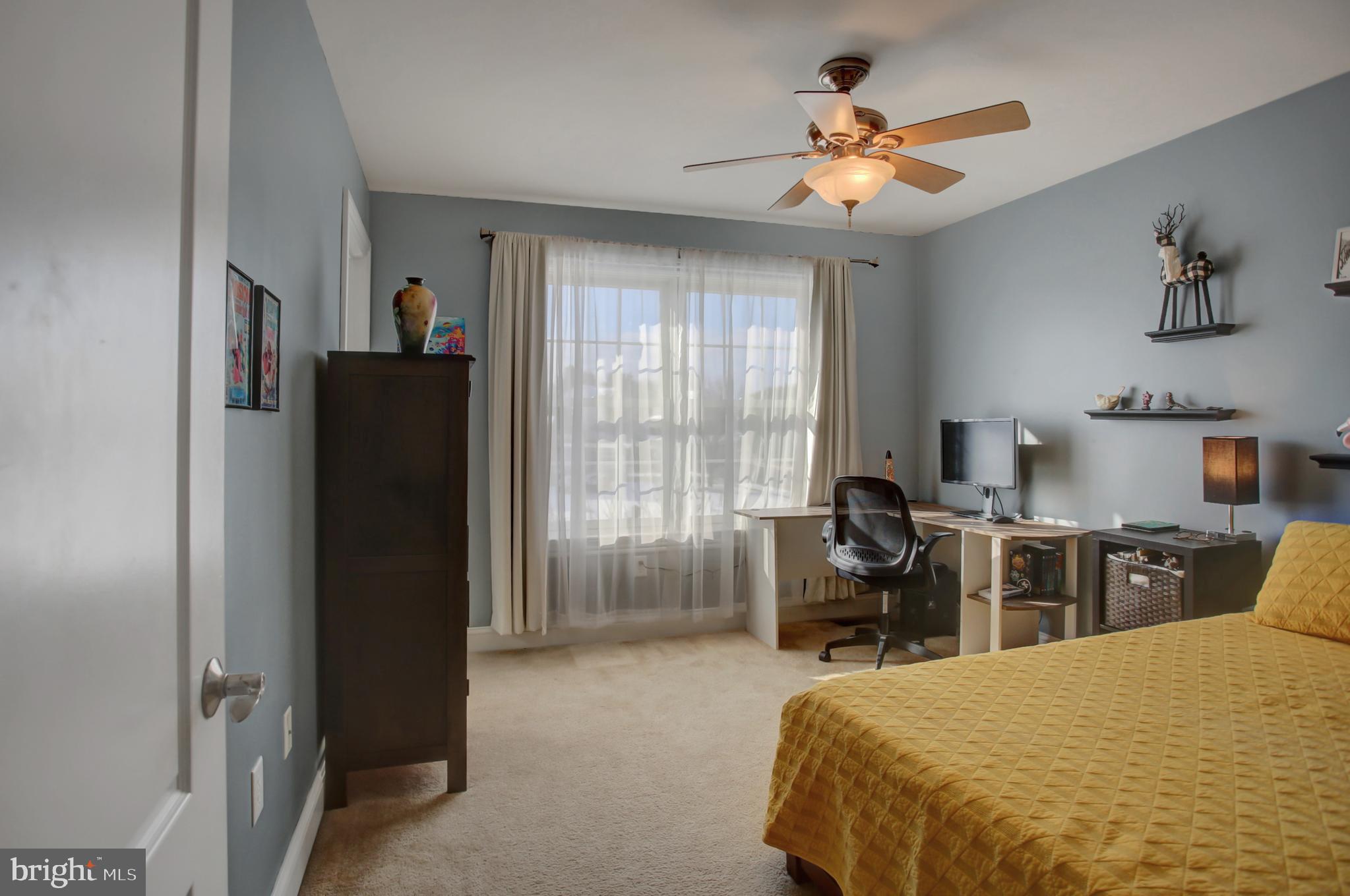 20 Netherby Lane Carlisle, PA 17015 - Photo 43 of 81 a bedroom with a bed and a chandelier