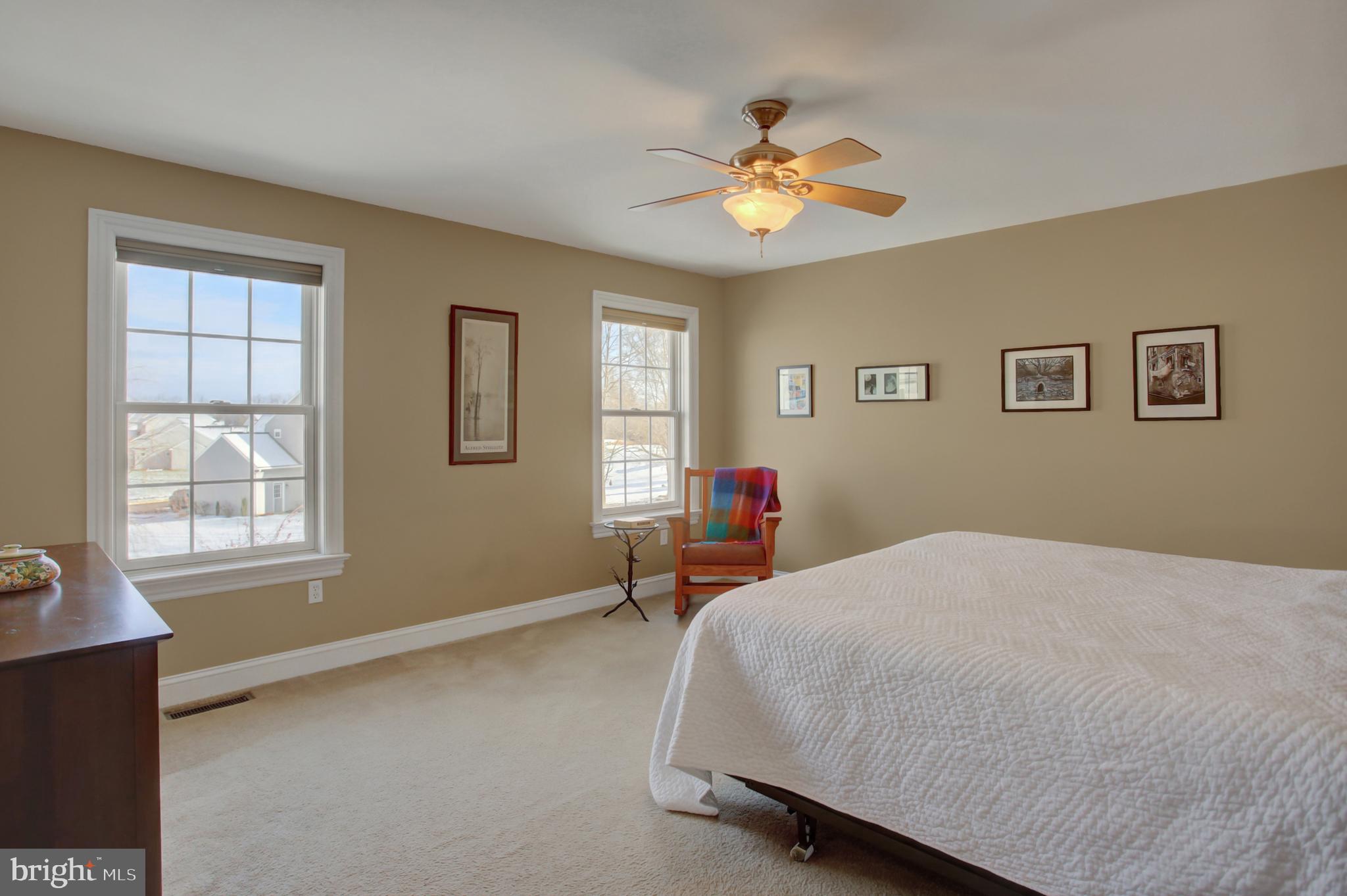 20 Netherby Lane Carlisle, PA 17015 - Photo 50 of 81 a bedroom with a bed and a chandelier