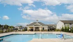 a front view of a house with a lake view