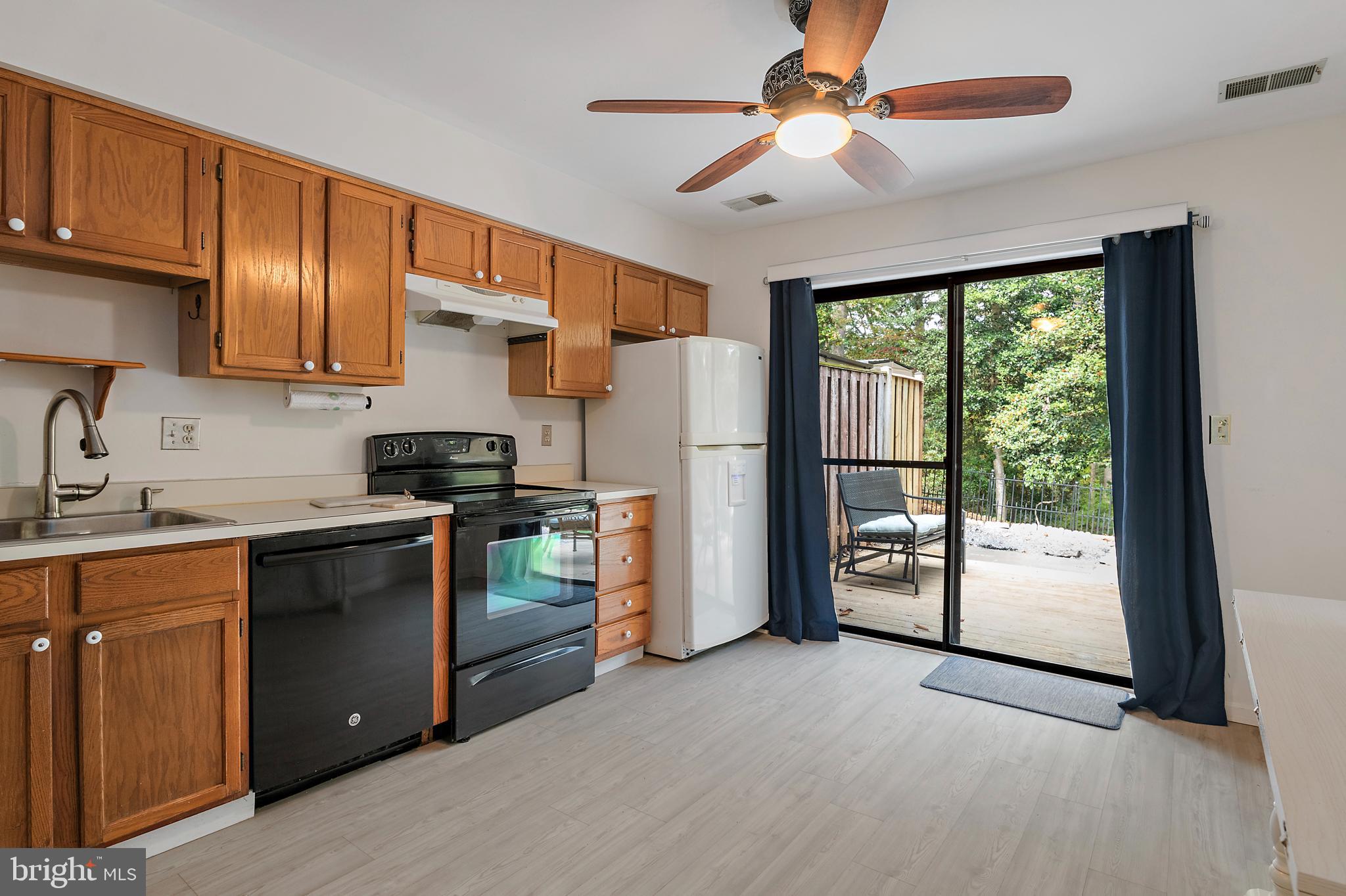 932 Riversedge Circle Annapolis, MD 21401 - Photo 11 of 42 a kitchen with stainless steel appliances granite countertop a refrigerator a sink a stove and a refrigerator