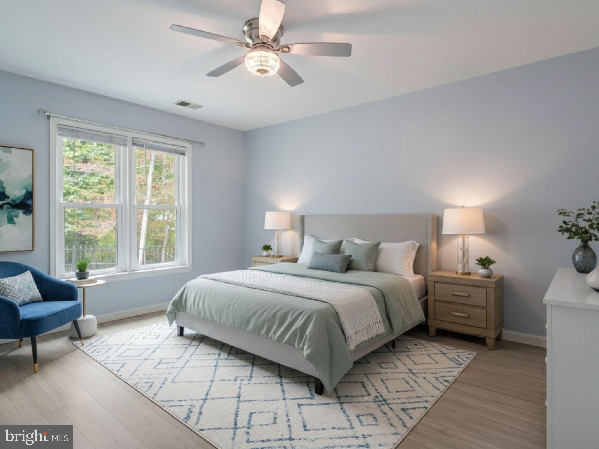 932 Riversedge Circle Annapolis, MD 21401 - Photo 18 of 42 a bedroom with a bed and a chandelier