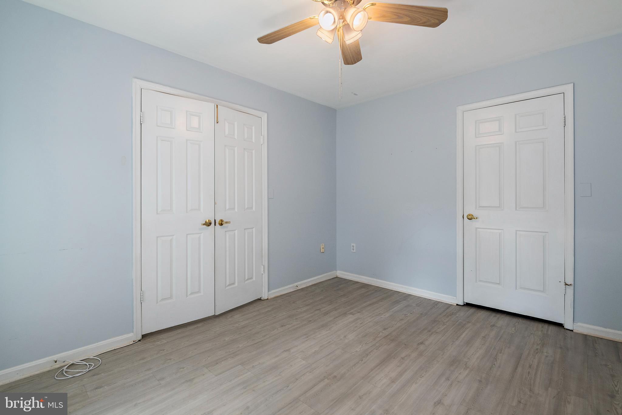 932 Riversedge Circle Annapolis, MD 21401 - Photo 18 of 42 a view of an empty room with wooden floor