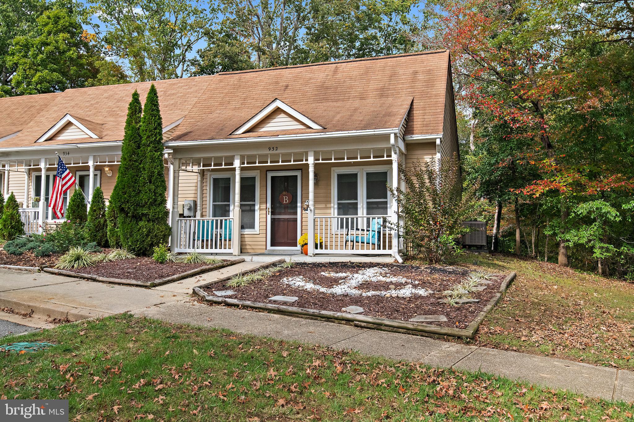 932 Riversedge Circle Annapolis, MD 21401 - Photo 2 of 42 a front view of a house with a garden and trees