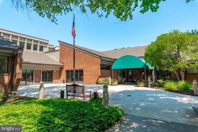 a front view of a house with a yard patio and fire pit
