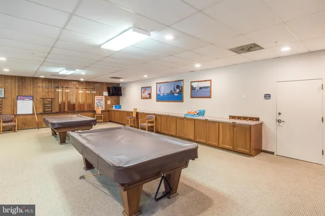 a room with furniture and pool table