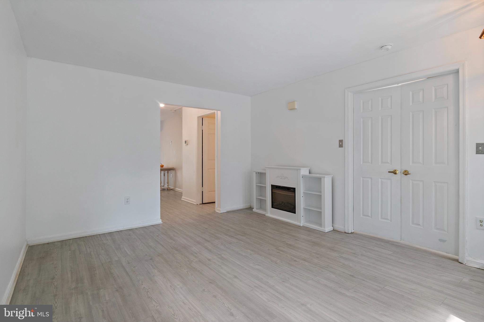 932 Riversedge Circle Annapolis, MD 21401 - Photo 7 of 42 a view of empty room with wooden floor and fireplace