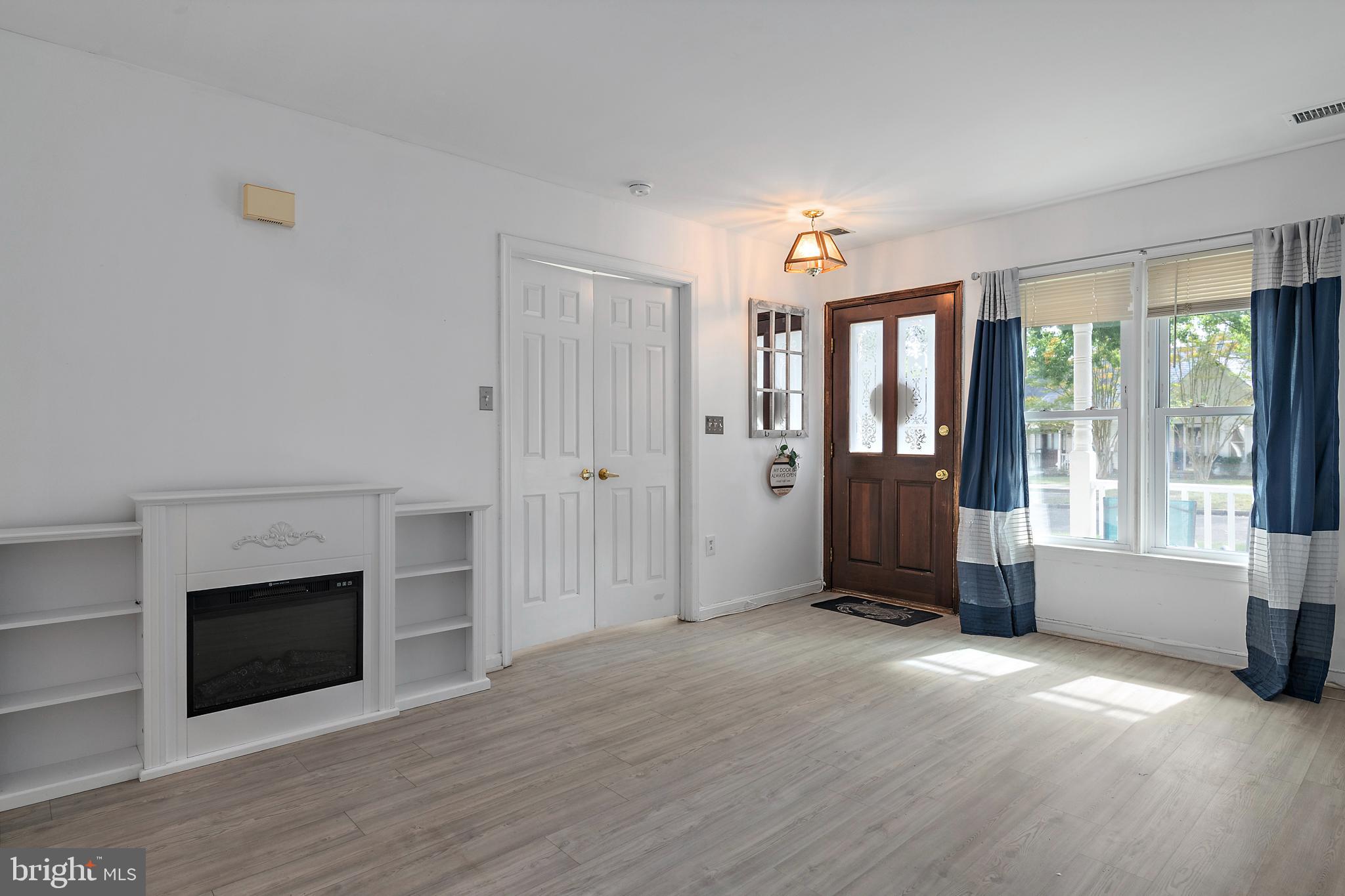 932 Riversedge Circle Annapolis, MD 21401 - Photo 9 of 42 an empty room with windows and fireplace