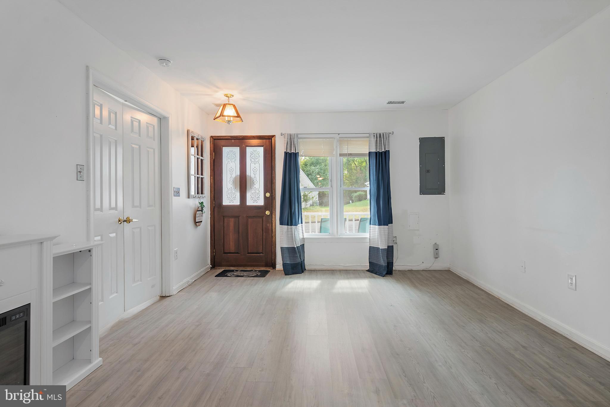 932 Riversedge Circle Annapolis, MD 21401 - Photo 10 of 42 wooden floor in an empty room with a window