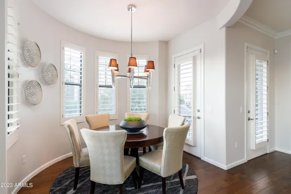 a dining room with furniture window wooden floor